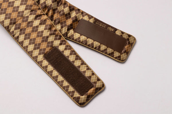 Slip Blockout Sleep Mask in a brown and beige argyle pattern, featuring adjustable hook-and-loop closures.