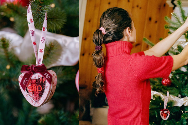 A split image showing a heart-shaped Christmas ornament with a pink and red patterned body, a dark red ribbon bow, and a pink printed ribbon loop, alongside a woman in a red sweater decorating a Christmas tree, with silk scrunchies in her hair.