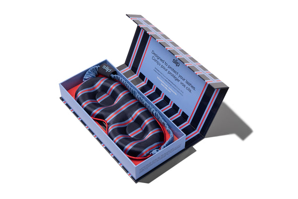 Striped silk contour sleep mask in a slip branded box on a white background