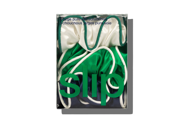 Green, Navy and White silk scrunchies in a box with 'slip' branding.